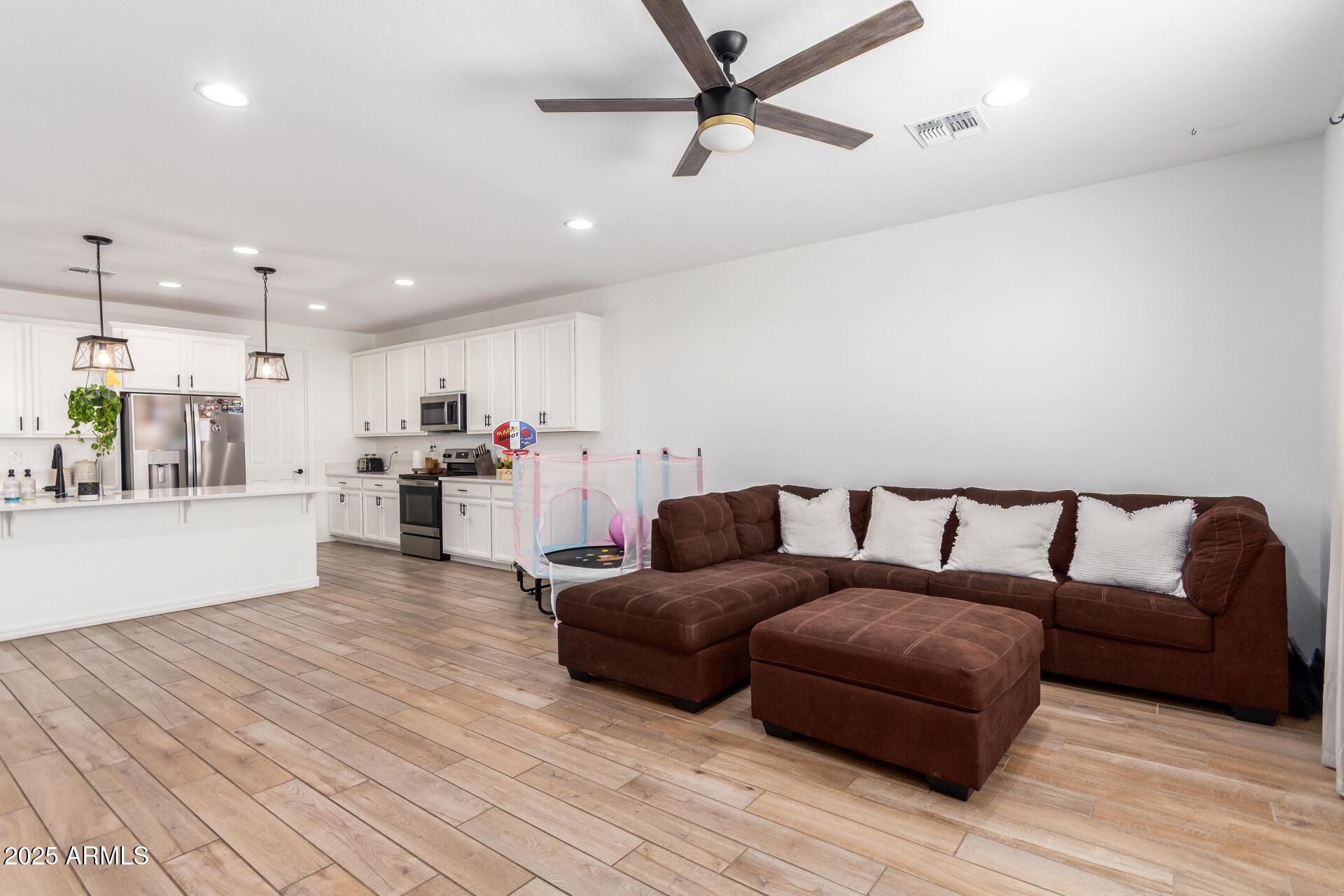 24608 Seed Road Florence, AZ 85132 - Photo 11 of 45 a living room with furniture and kitchen view