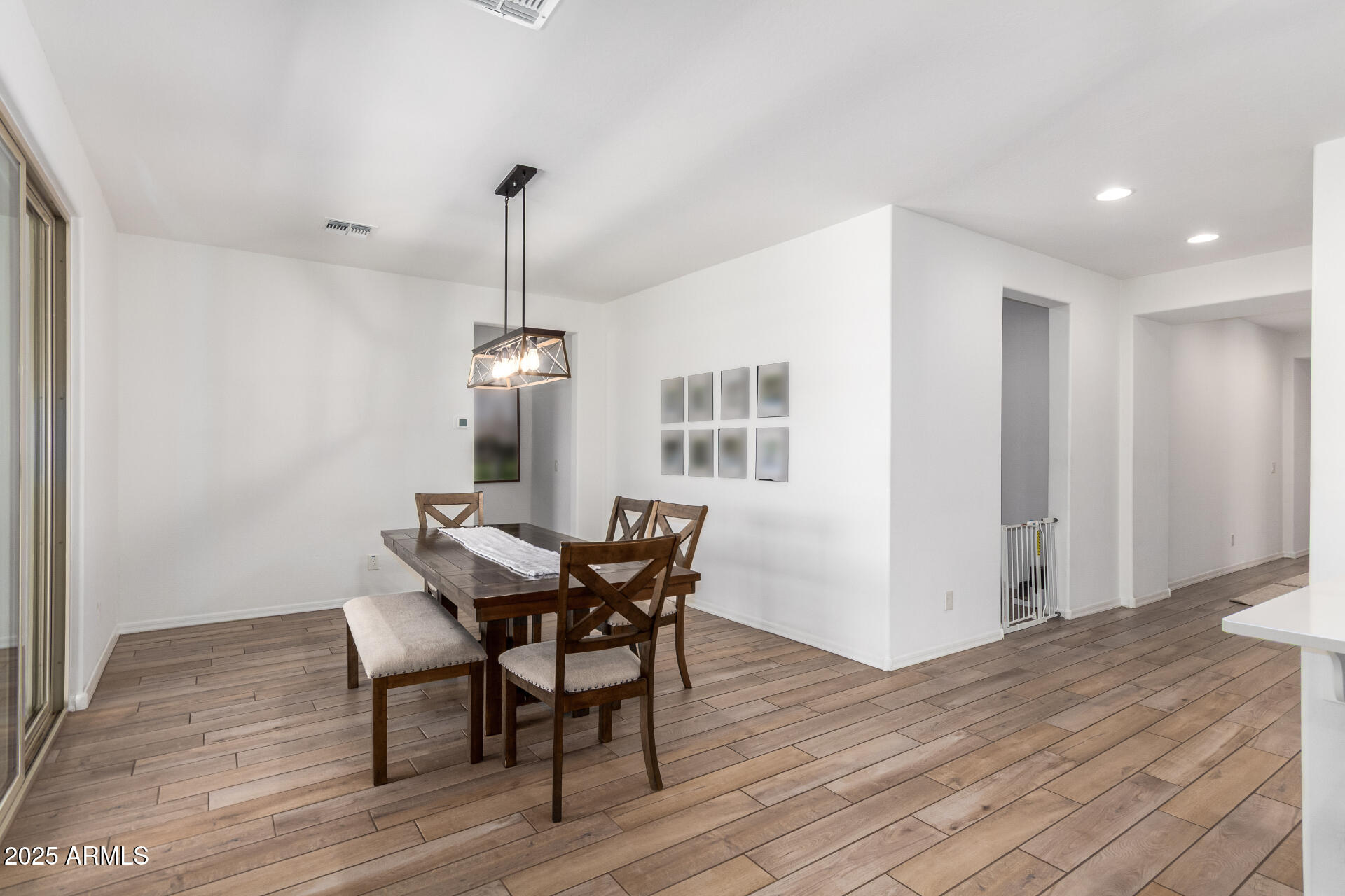 24608 Seed Road Florence, AZ 85132 - Photo 12 of 45 a view of a dining room with furniture window and wooden floor