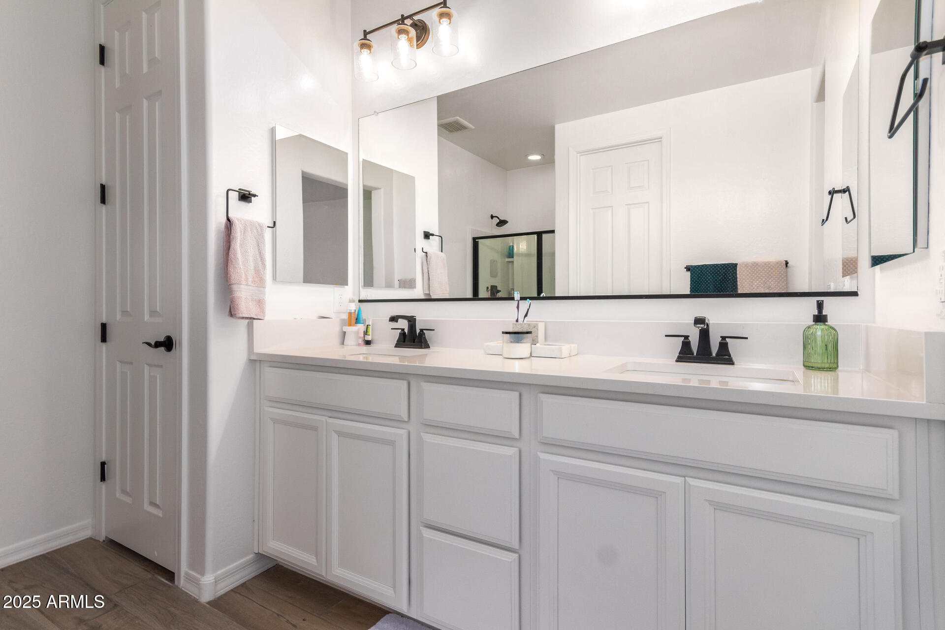 24608 Seed Road Florence, AZ 85132 - Photo 21 of 45 a bathroom with double sink and a mirror