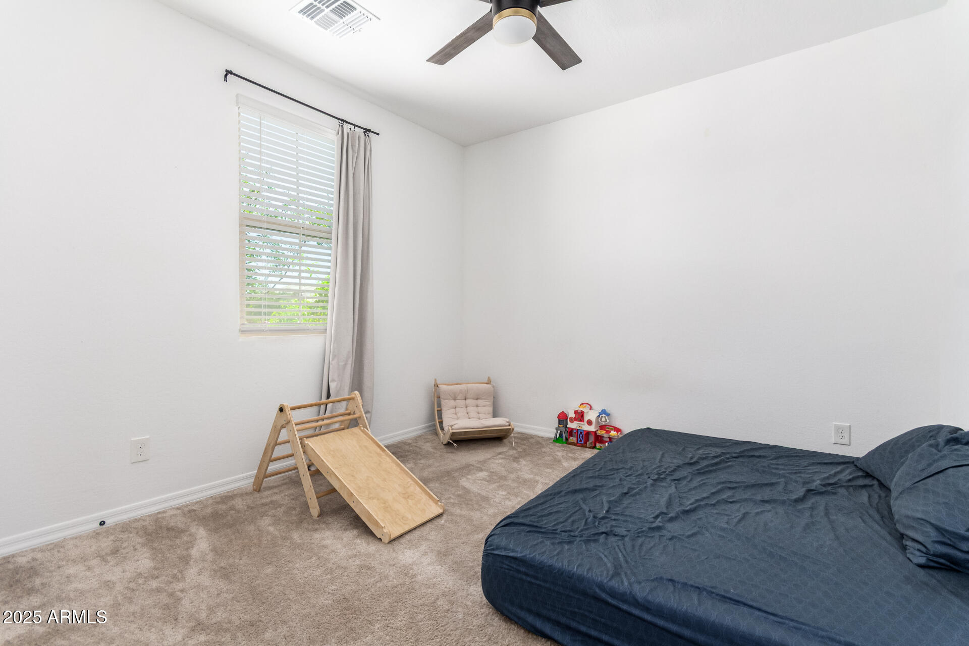 24608 Seed Road Florence, AZ 85132 - Photo 24 of 45 a living room with furniture and a window