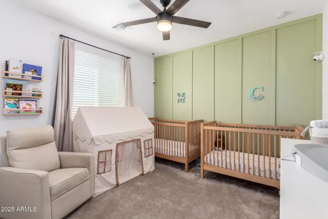 a bedroom with furniture and a window