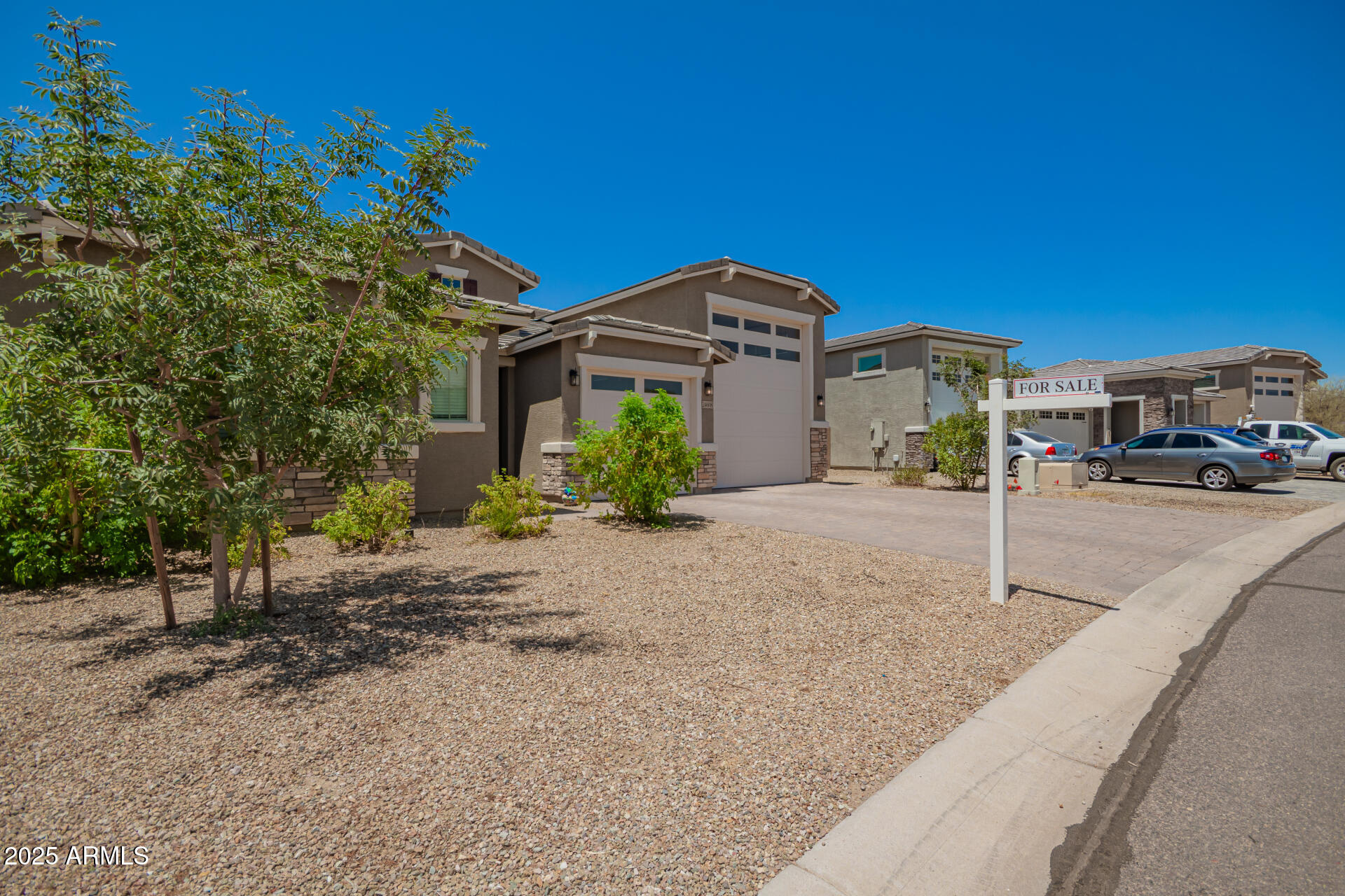 24608 Seed Road Florence, AZ 85132 - Photo 3 of 45 a front view of a house with a yard and garage