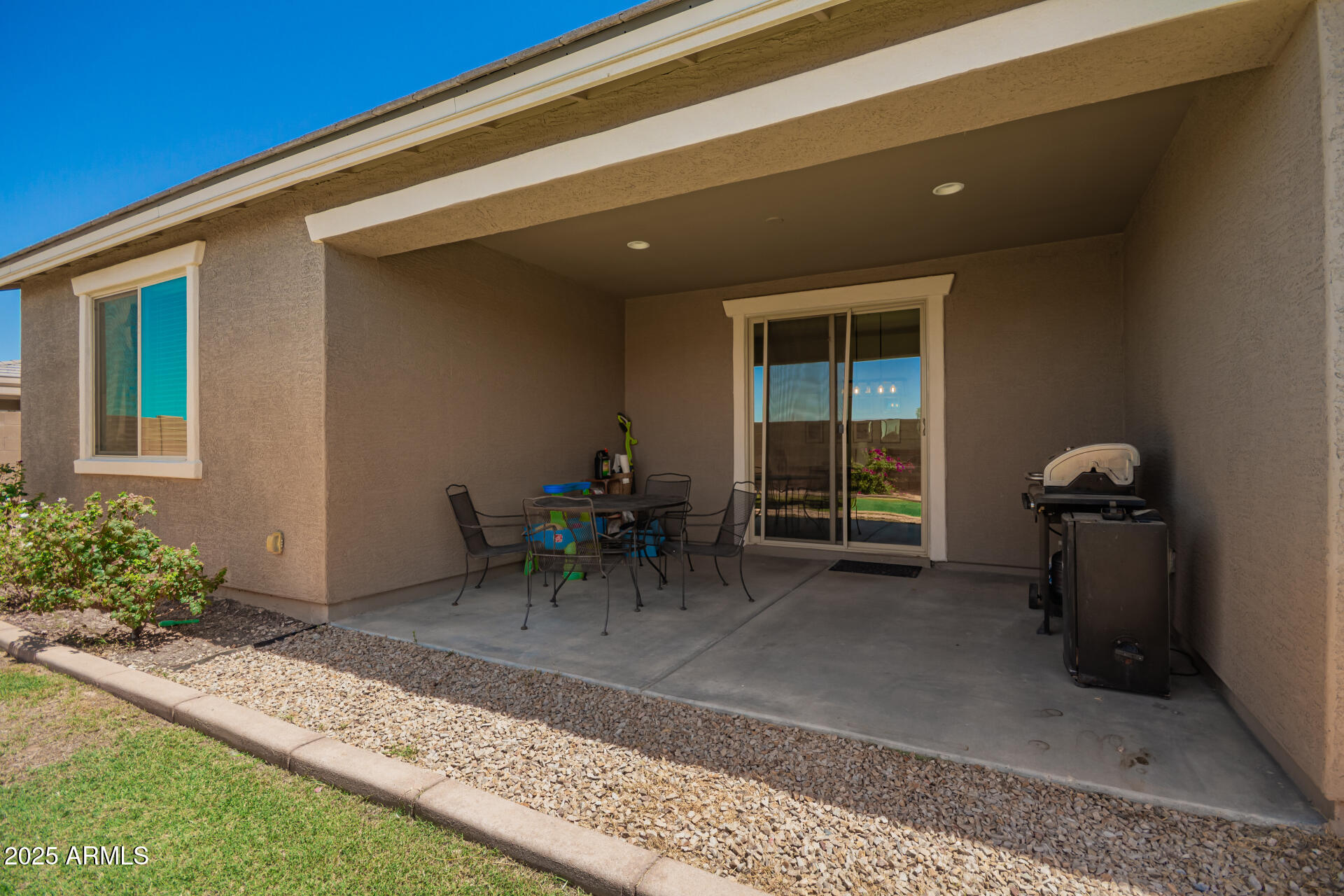 24608 Seed Road Florence, AZ 85132 - Photo 33 of 45 a view of a porch with a table and chairs