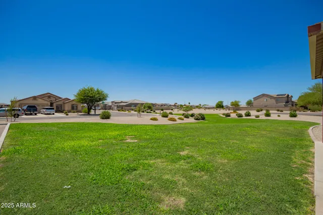 a view of green field of house with lots of green space