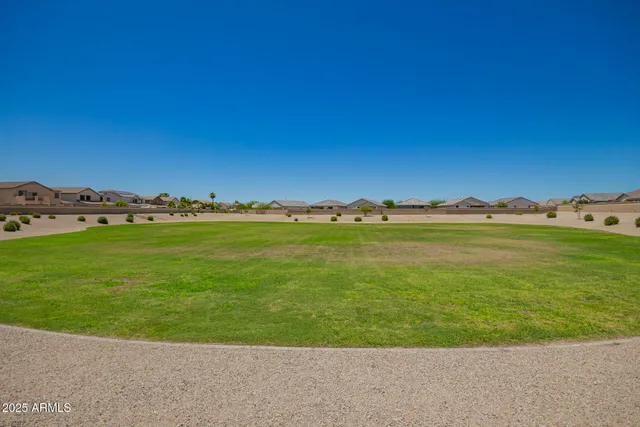 a view of a large building with a big yard