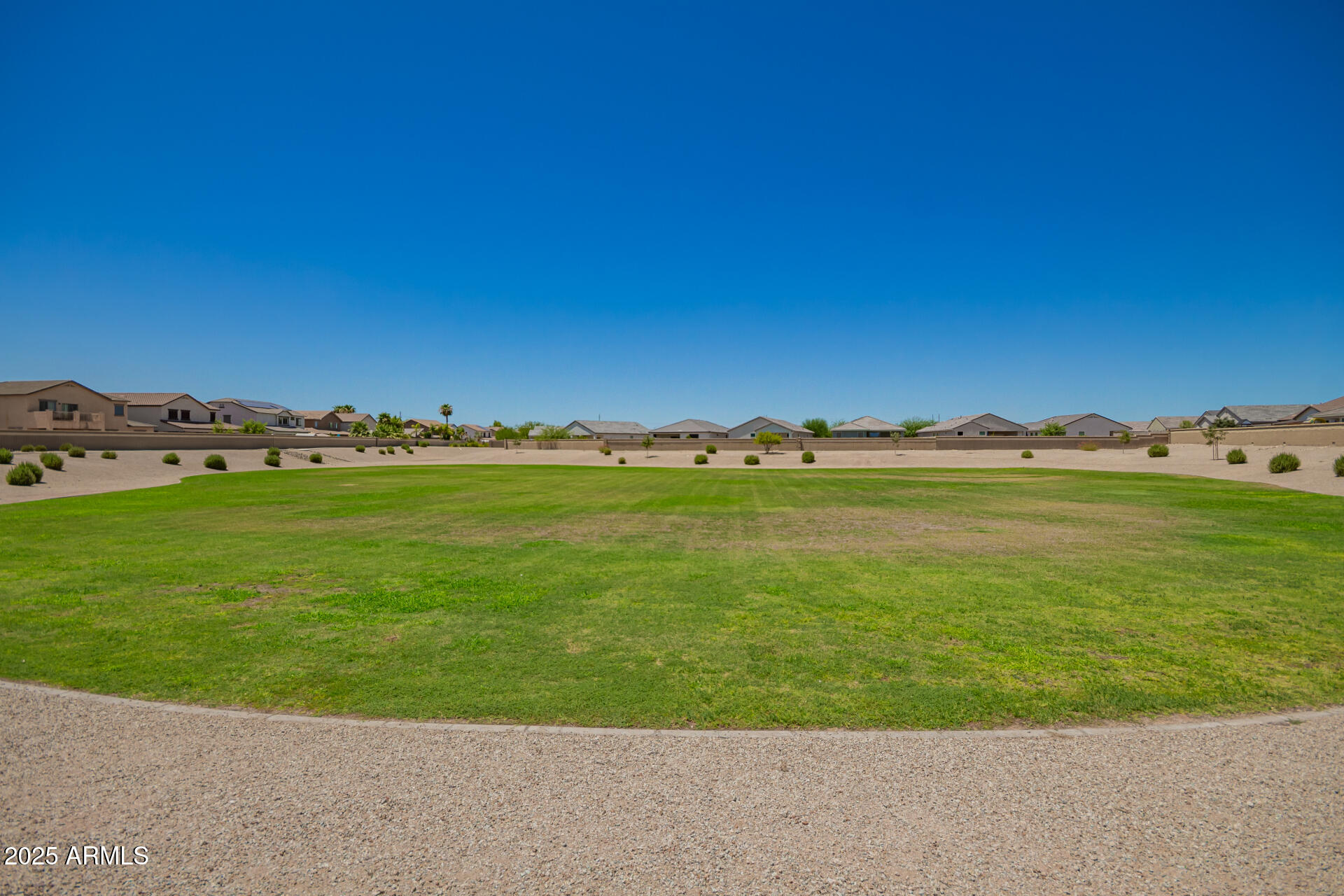 24608 Seed Road Florence, AZ 85132 - Photo 39 of 45 a view of a large building with a big yard