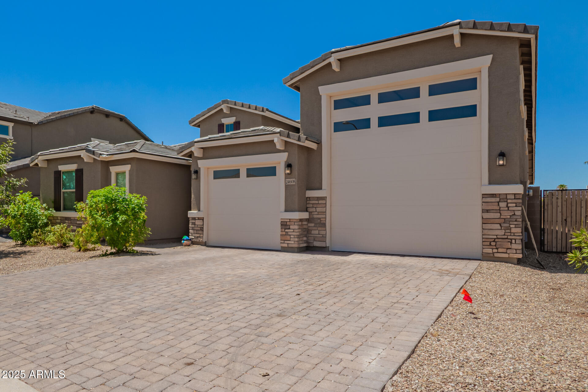 24608 Seed Road Florence, AZ 85132 - Photo 6 of 45 a front view of a house with a garage