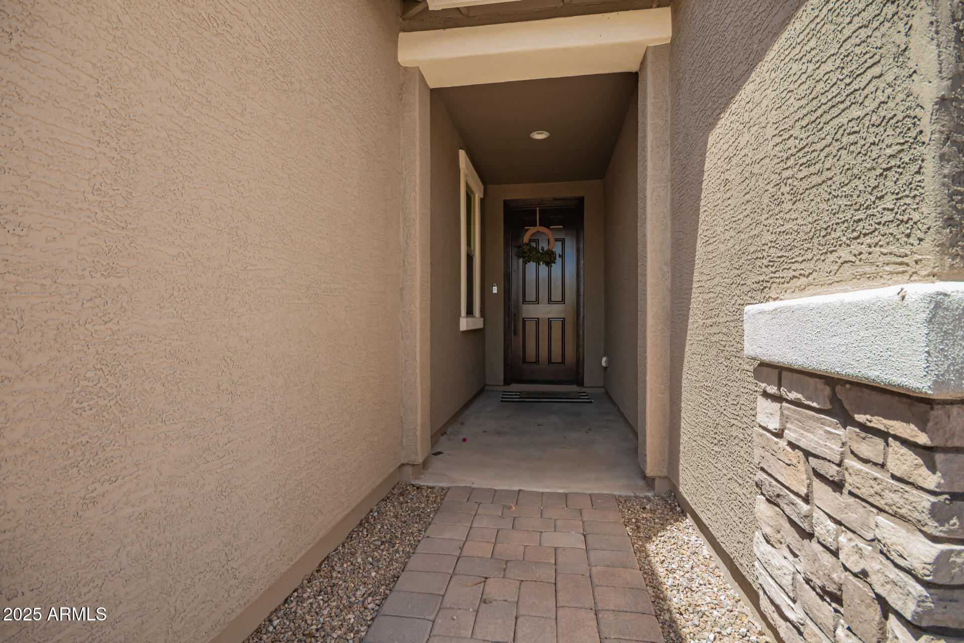 24608 Seed Road Florence, AZ 85132 - Photo 7 of 45 a view of a hallway with wooden floor and a bathroom