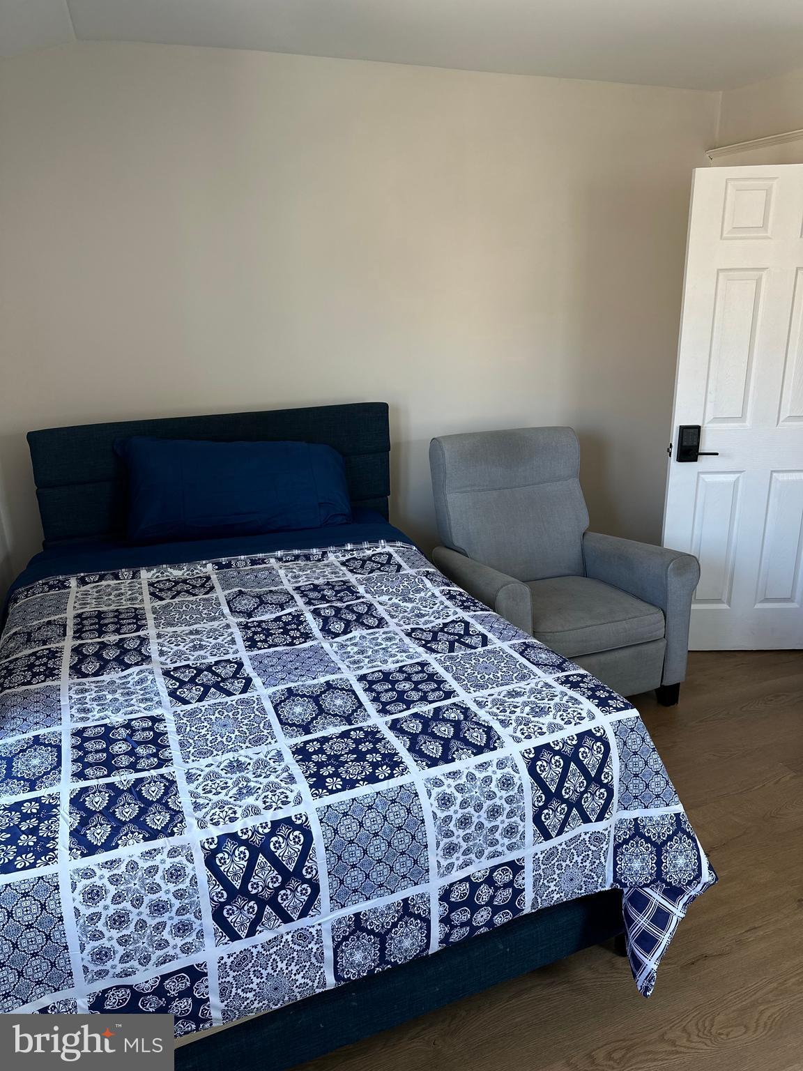114 West 5th Street, Unit 1 Media, PA 19063 - Photo 2 of 11 a bedroom with a bed and a couch