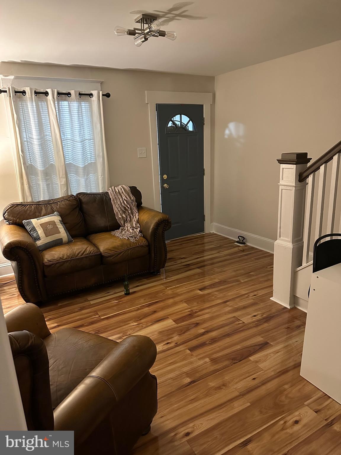 114 West 5th Street, Unit 1 Media, PA 19063 - Photo 5 of 11 a living room with furniture and a wooden floor