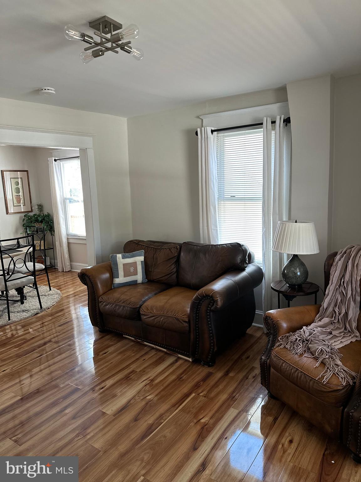 114 West 5th Street, Unit 1 Media, PA 19063 - Photo 6 of 11 a living room with furniture and wooden floor