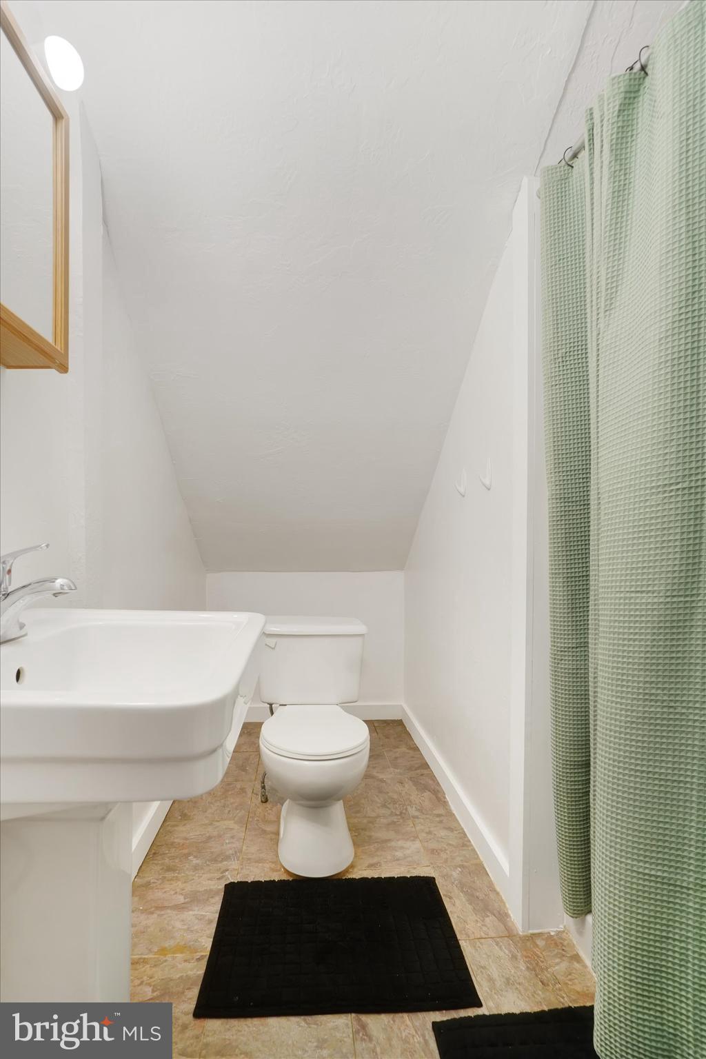 6983 Lake Road York, PA 17403 - Photo 17 of 28 a bathroom with a toilet a sink and a shower