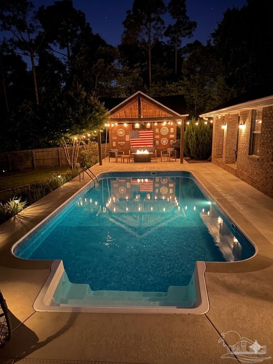 3055 Wallace Lake Road Pace, FL 32571 - Photo 2 of 33 a view of swimming pool with a yard