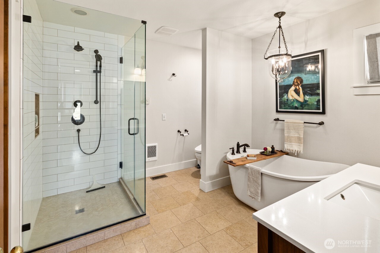 3920 Weaver Road Ellensburg, WA 98926 - Photo 16 of 40 a bathroom with a tub sink mirror and shower