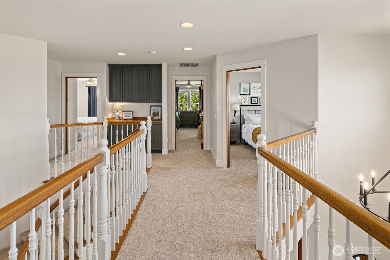 3920 Weaver Road Ellensburg, WA 98926 - Photo 22 of 40 a view of a hallway with wooden floor stairs