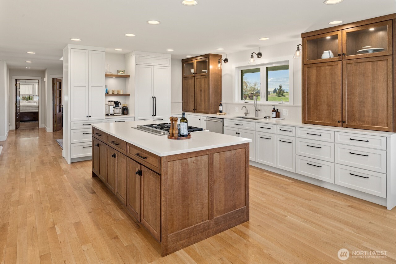 3920 Weaver Road Ellensburg, WA 98926 - Photo 5 of 40 a kitchen with white cabinets sink and stove