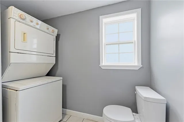 a white toilet sitting next to a bathroom sink