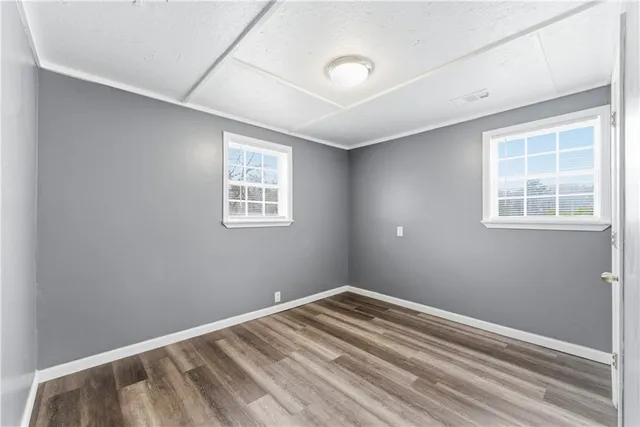 a view of empty room with windows