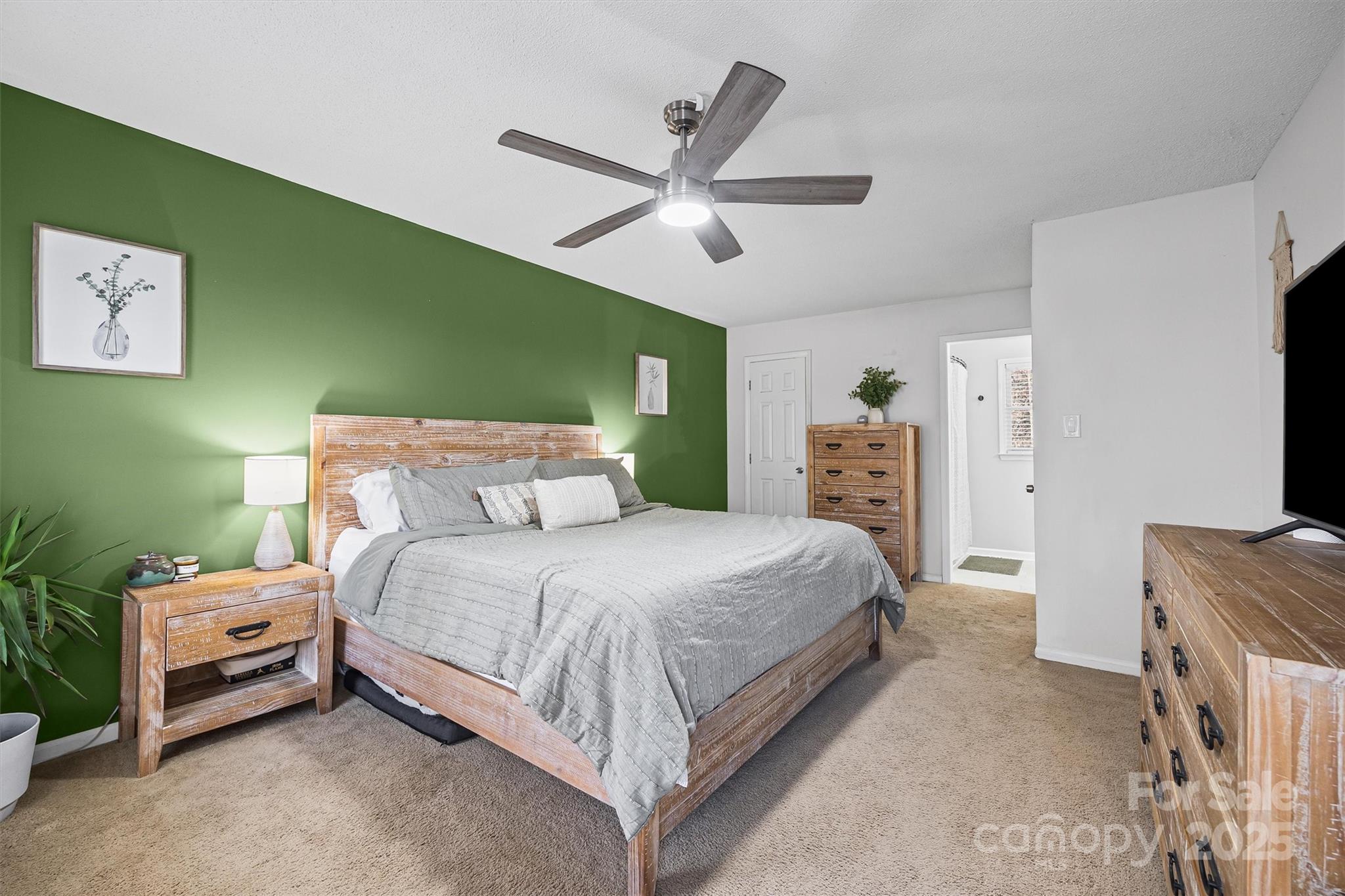 521 Rabun Circle Rock Hill, SC 29730 - Photo 14 of 28 a bedroom with a bed and a chandelier