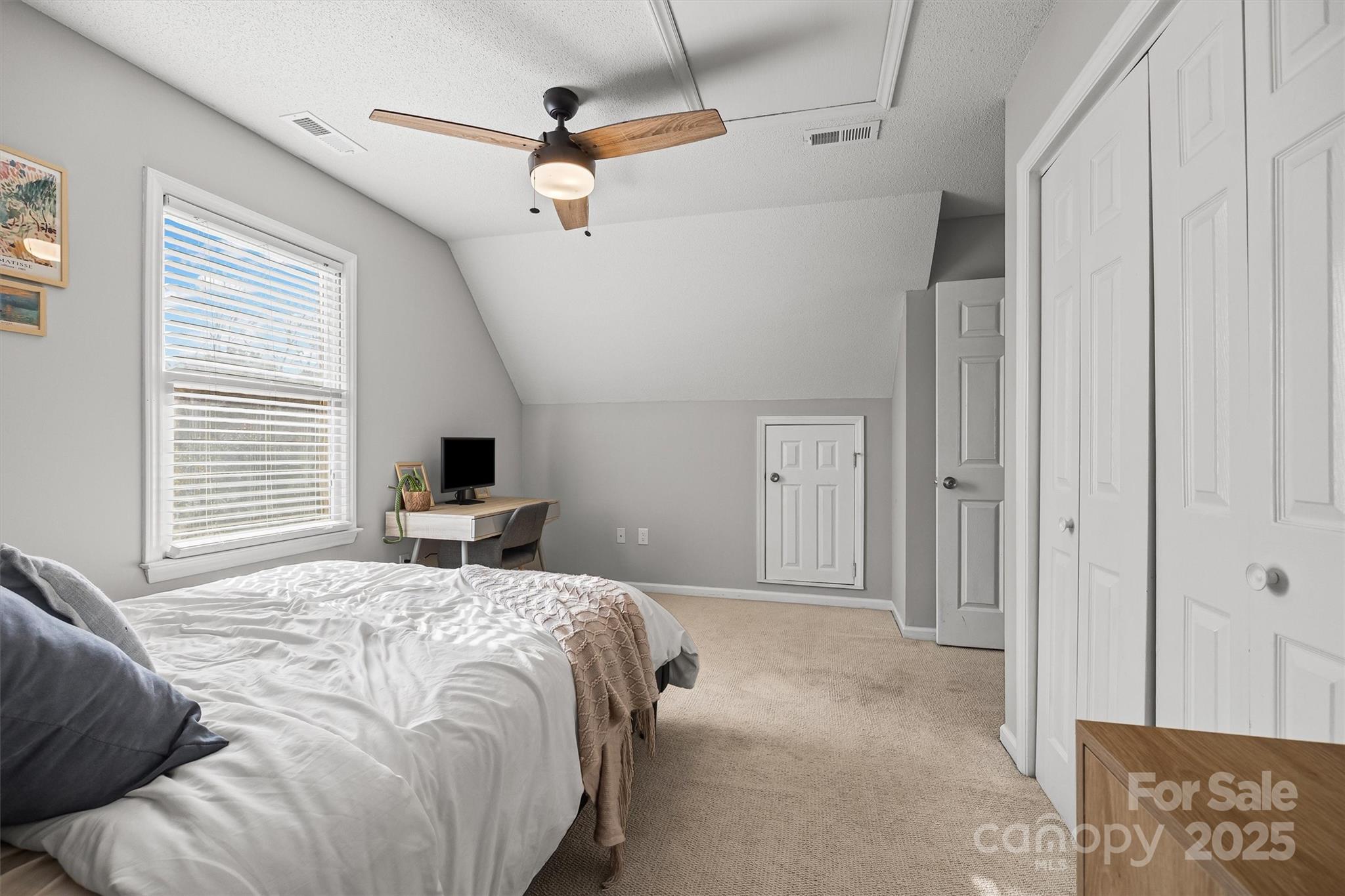 521 Rabun Circle Rock Hill, SC 29730 - Photo 17 of 28 a bedroom with a large bed a flat tv screen and a dresser