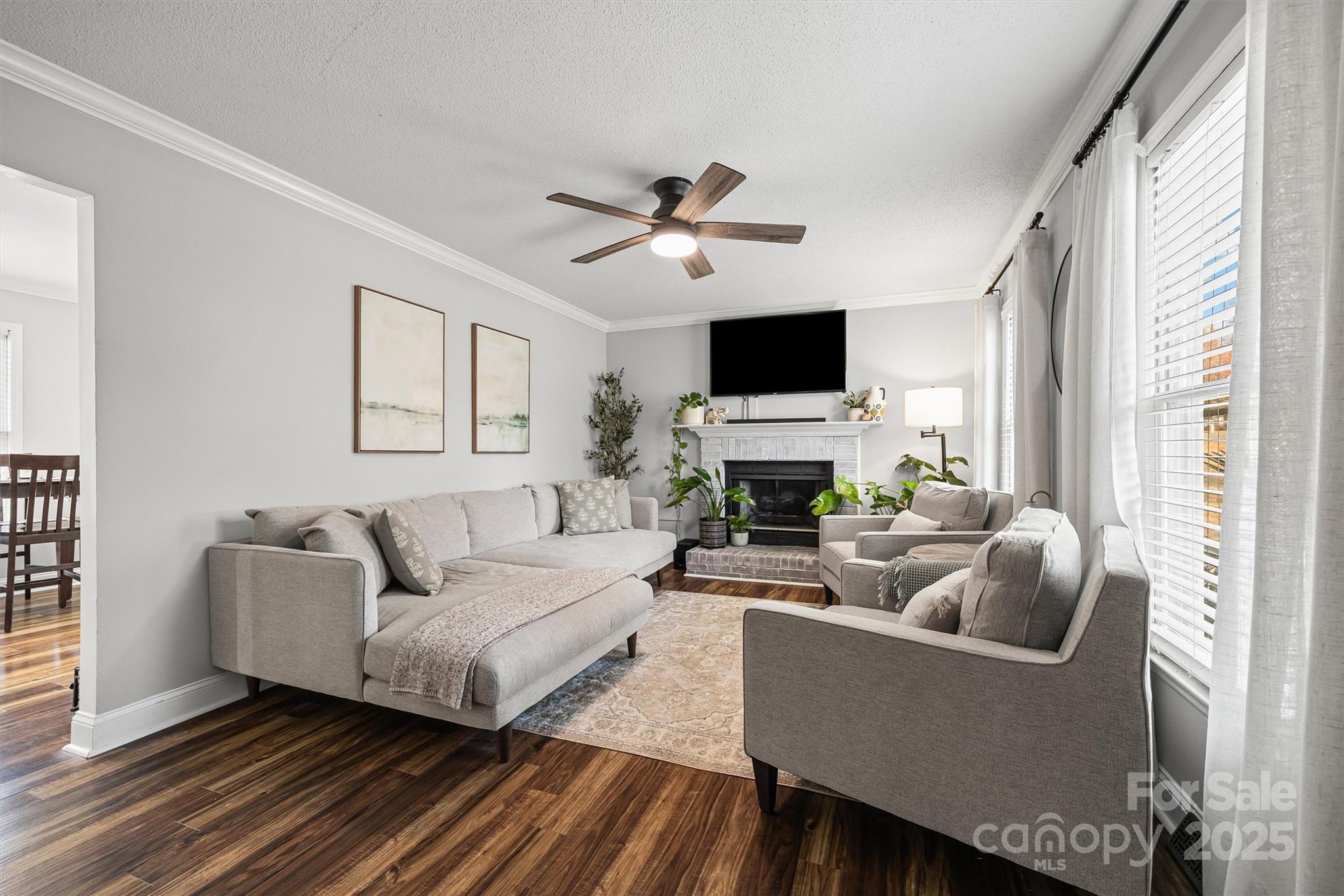 521 Rabun Circle Rock Hill, SC 29730 - Photo 5 of 28 a living room with furniture a fireplace and a flat screen tv