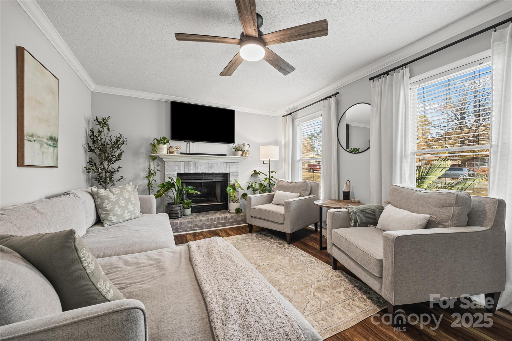521 Rabun Circle Rock Hill, SC 29730 - Photo 6 of 28 a living room with furniture a flat screen tv and a large window