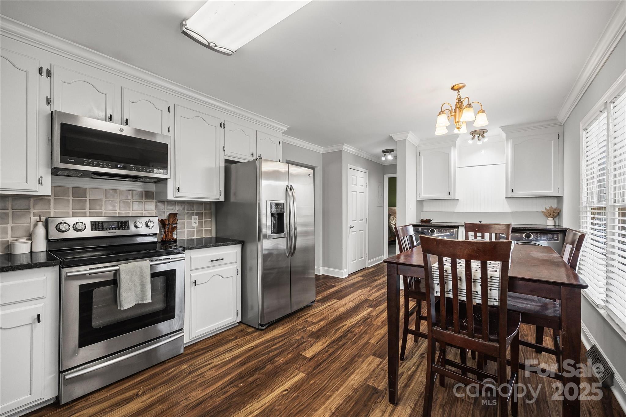 521 Rabun Circle Rock Hill, SC 29730 - Photo 10 of 28 a kitchen with stainless steel appliances a stove a sink microwave and a refrigerator