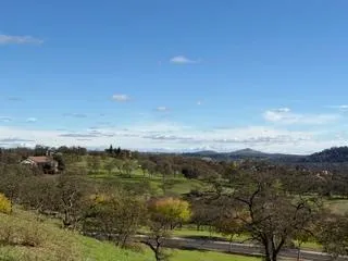 a view of a golf course with a lake