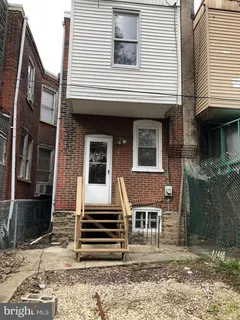 a view of backyard with wooden door