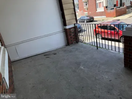 a view of a porch with wooden floor