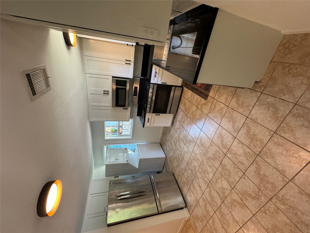 1907 Haskell Street, Unit A Austin, TX 78702 - Photo 1 of 1 a kitchen with a sink and a stove top oven
