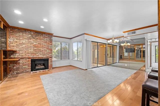 a view of livingroom with fireplace and window