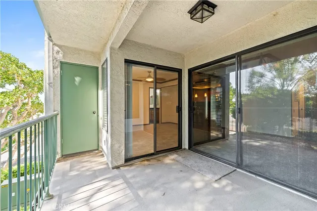 a view of a hallway with a glass door