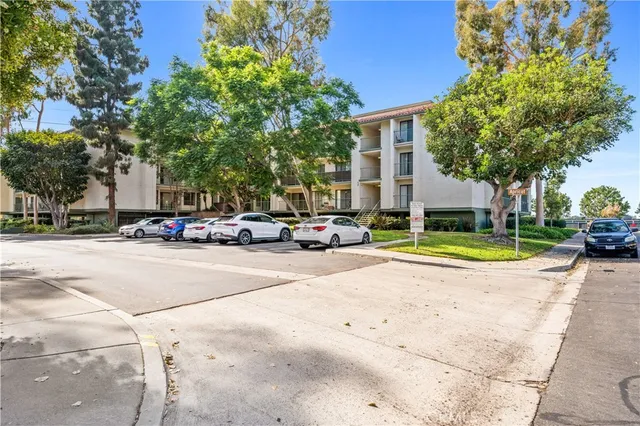 a view of a cars park on side of road