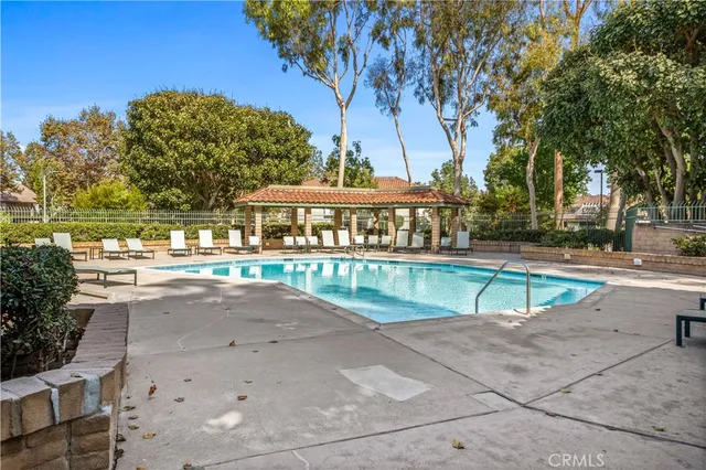 a view of a swimming pool with a patio