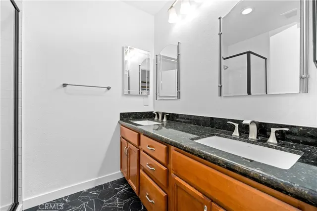 a kitchen with stainless steel appliances granite countertop a sink and a granite counter tops