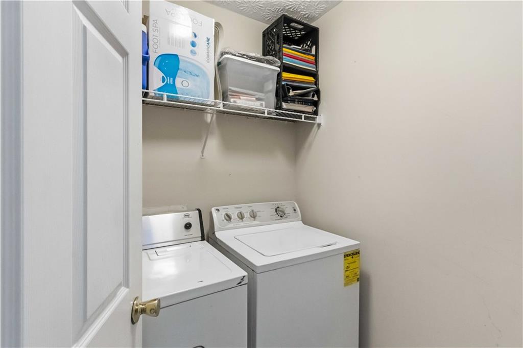 6031 Grovegate Lane Tucker, GA 30084 - Photo 21 of 26 a utility room with dryer and washer