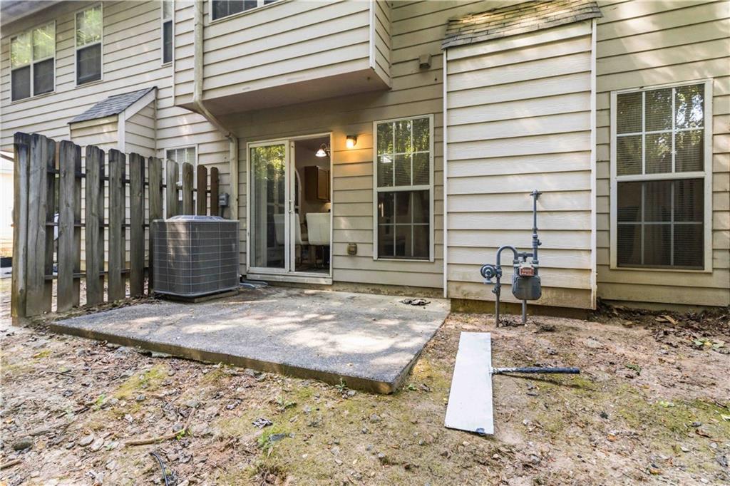 6031 Grovegate Lane Tucker, GA 30084 - Photo 22 of 26 a front view of a house with a large window