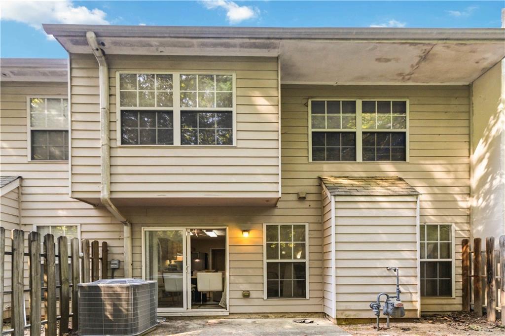 6031 Grovegate Lane Tucker, GA 30084 - Photo 24 of 26 a view of a brick building with a window and a floor