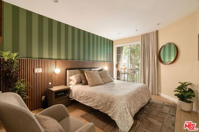 a bedroom with a bed and outer view