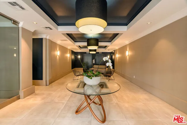 a view of a livingroom with furniture and chandelier