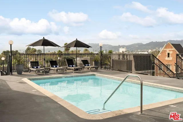 a view of swimming pool with seating space