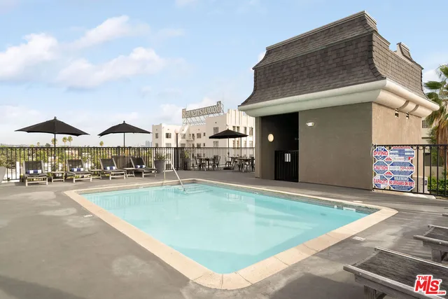 a view of a swimming pool with a patio