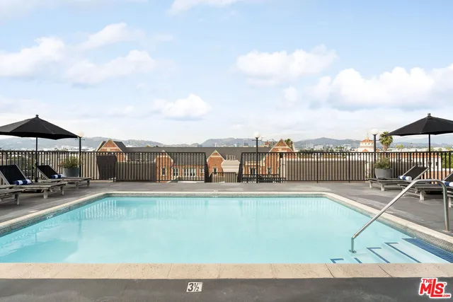 a view of a chairs and table in the balcony