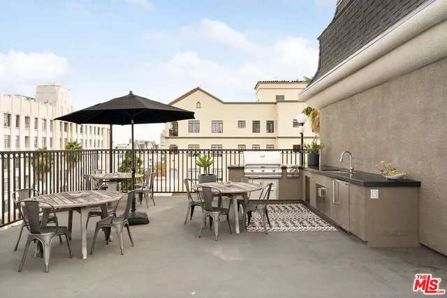 a view of a house with swimming pool and sitting area