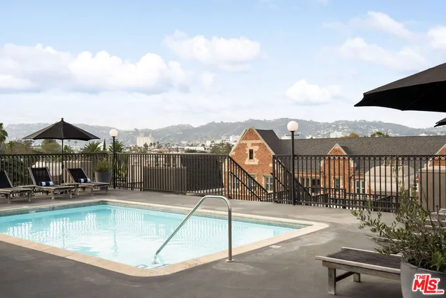 a room with gym equipment and a flat screen tv