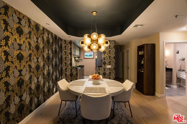 a dining room with furniture and wooden floor