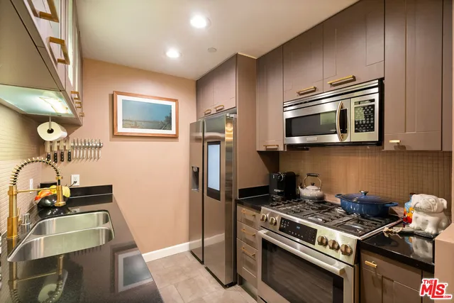 a kitchen with a stove and a microwave