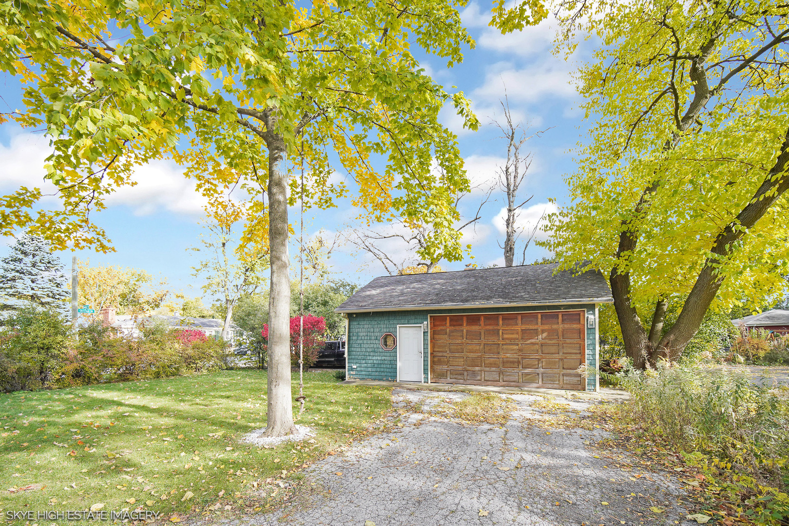 2163 Chestnut Road Homewood, IL 60430 - Photo 25 of 31 a front view of a house with a yard and garage