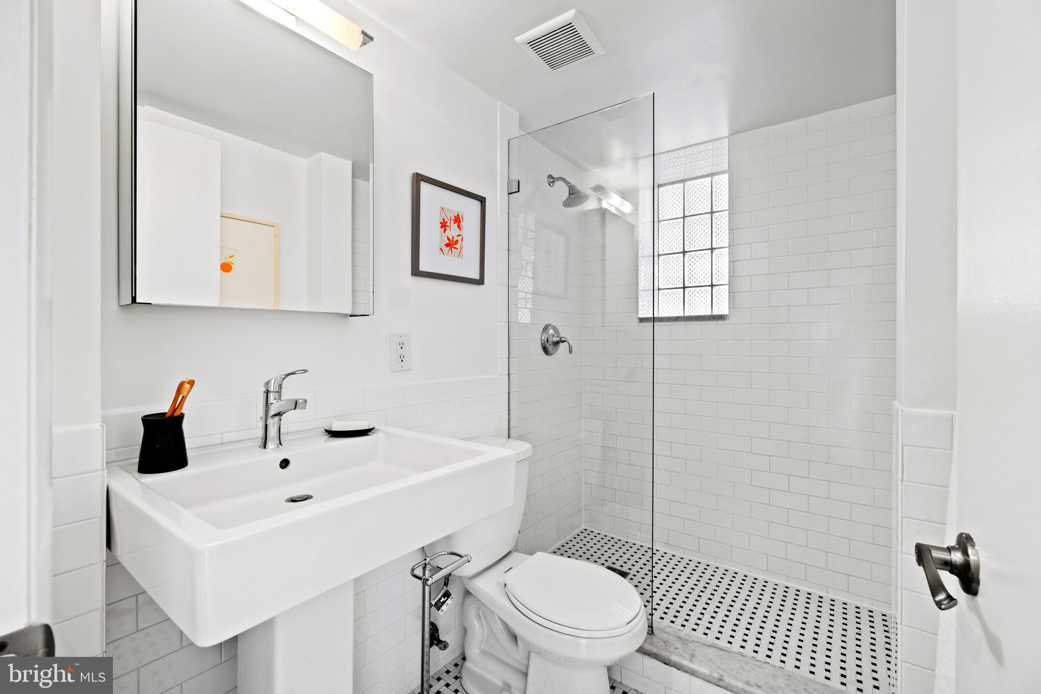 1701 16th Street Northwest, Unit 317 Washington, DC 20009 - Photo 11 of 15 Updated bathroom